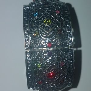 Thick silver bracelet with multiple color stones